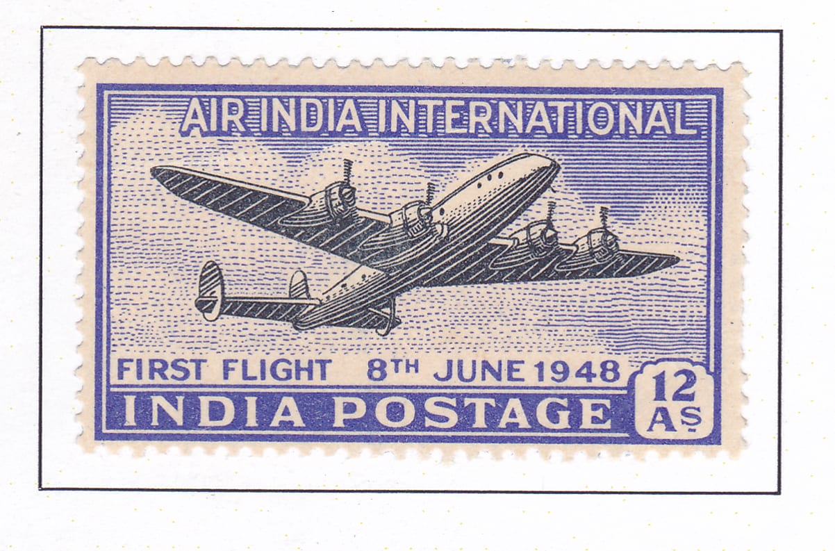 An Indian postage stamp printed in violet-blue: a four-engined Lockheed Constellation seen from below and behind, banking against a finely hatched sky, with AIR INDIA INTERNATIONAL across the top, FIRST FLIGHT 8TH JUNE 1948 beneath it, INDIA POSTAGE along the bottom and the value 12 As in the corner.