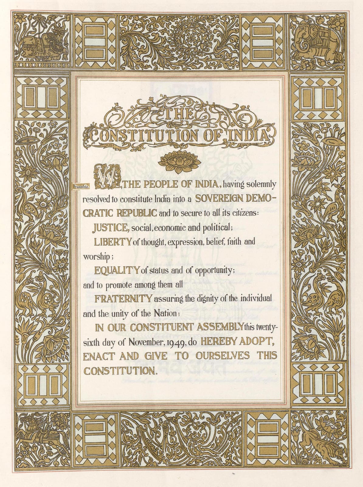 The Preamble page of the Constitution of India: a block of hand-lettered text beginning WE, THE PEOPLE OF INDIA, with JUSTICE, LIBERTY, EQUALITY and FRATERNITY picked out in capitals, framed by a wide gold border of foliage, peacocks, elephants, a bull and a chariot. A pale blue watermark of the Lion Capital sits behind the text.